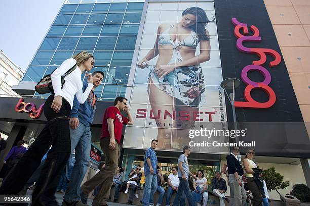 Fashionable dressed young turks passing a advertising billboard at the store Boyner on May 29, 2005 in Istanbul, Turkey. Today Boyner, as a member of...