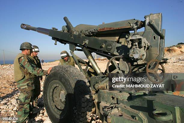 Lebanese army troopers inspect a 155mm Howitzer gun as they take part in a joint military drill with the United Nations Iterim Forces in Lebanon...