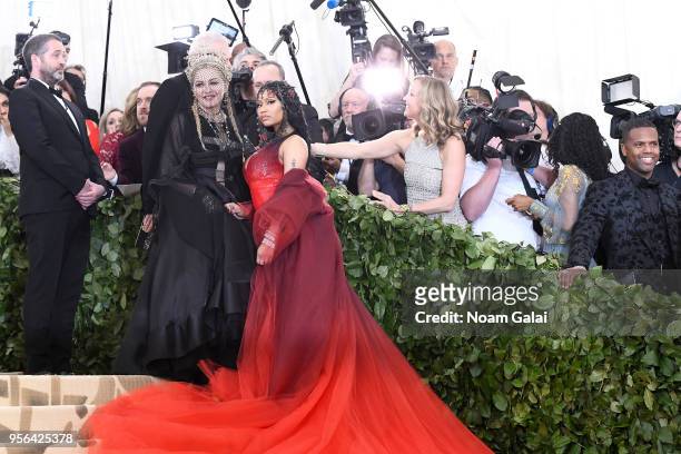Recording artists Madonna and Nicki Minaj attend the Heavenly Bodies: Fashion & The Catholic Imagination Costume Institute Gala at The Metropolitan...