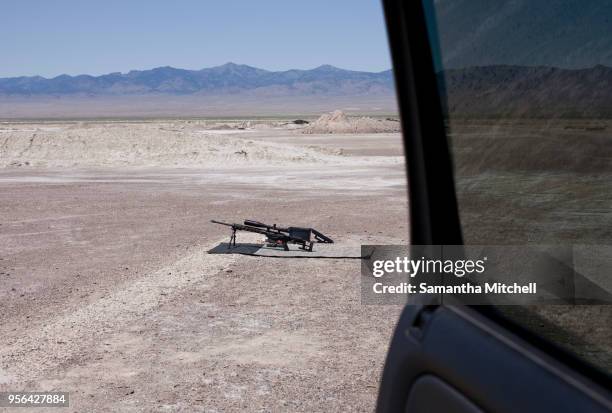 view from car door of semi automatic weapon at firing range at wendover, utah, usa - wendover stock pictures, royalty-free photos & images