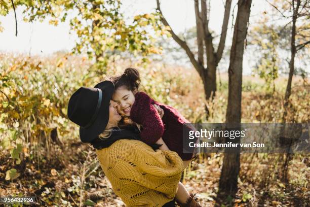 mother kissing and hugging daughter, oshawa, canada, north america - oshawa 個照片及圖片檔
