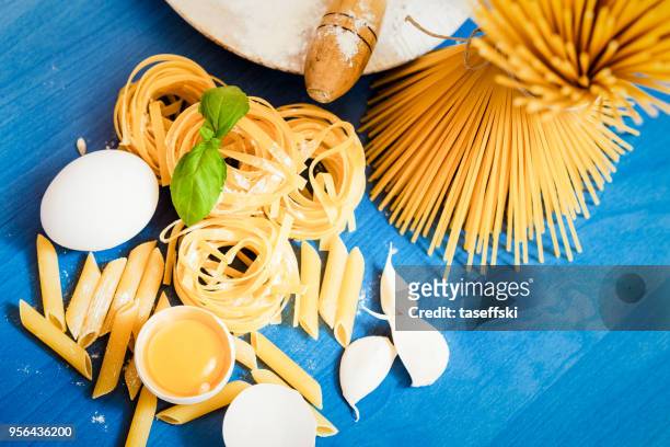 raw pasta - taseffski stock pictures, royalty-free photos & images
