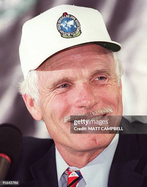 Time-Warner Vice Chairman and Goodwill Games Founder Ted Turner smiles as he listens to a question at a press conference 18 July at Madison Square...