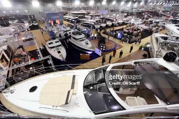 Visitors to the London International Boat Show view the huge power boats on display in the ExCeL exhibition centre on the opening day of the show on...