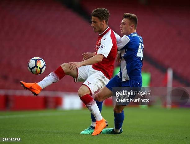 Vlad Dragomir of Arsenal U23s holds of Oleg Reabciuk of Porto FC during Premier League International Cup Final match between Arsenal Under 23 against...