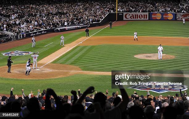 Phil Hughes of the New York Yankees strikes out Orlando Cabrera of the Minnesota Twins in Game One of the ALDS during the 2009 MLB Playoffs at Yankee...