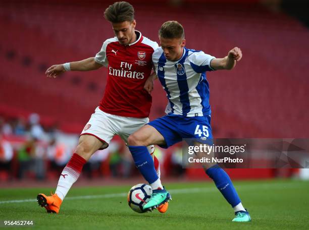 Vlad Dragomir of Arsenal U23s holds of Oleg Reabciuk of Porto FC during Premier League International Cup Final match between Arsenal Under 23 against...