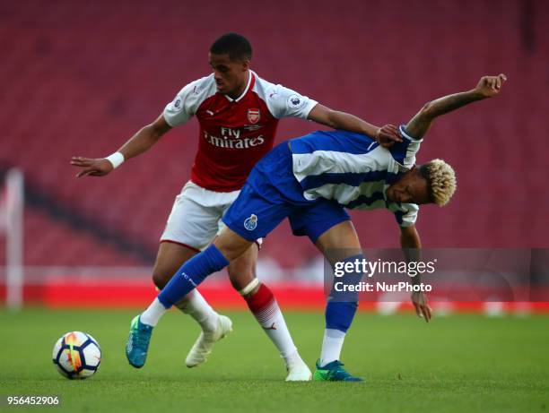 Josh Da silva of Arsenal U23s holds of Luiz Palmares of Porto FC during Premier League International Cup Final match between Arsenal Under 23 against...