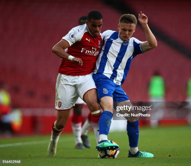 Yassin Fortune of Arsenal U23s holds of Oleg Reabciuk of Porto FC during Premier League International Cup Final match between Arsenal Under 23...