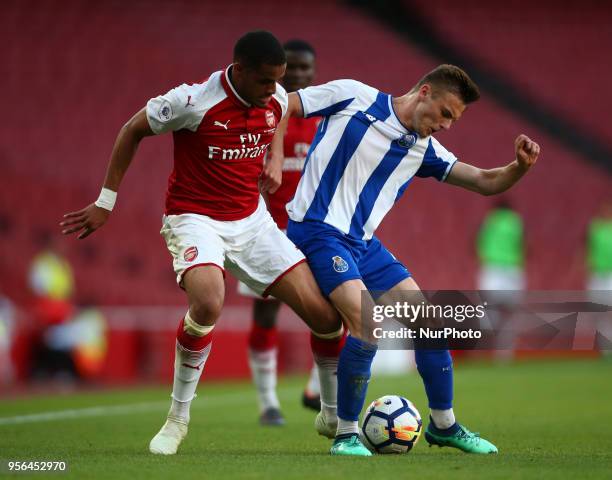 Yassin Fortune of Arsenal U23s holds of Oleg Reabciuk of Porto FC during Premier League International Cup Final match between Arsenal Under 23...