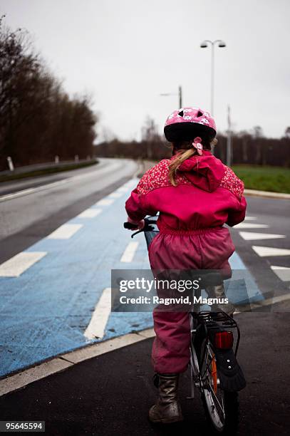 girl on a bicycle, denmark. - cerise stock pictures, royalty-free photos & images