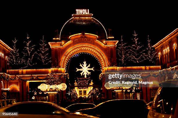 main entrance to an amusement park, copenhagen, denmark. - copenhagen christmas stock pictures, royalty-free photos & images