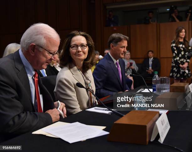 Gina Haspel arrives to testify next to former US Senator Saxby Chambliss and Sen Evan Bayh before the Senate Intelligence Committee on her nomination...