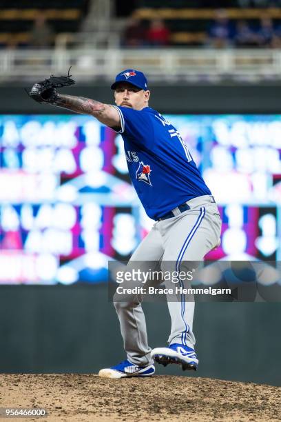 John Axford of the Toronto Blue Jays pitches against the Minnesota Twins on May 1, 2018 at Target Field in Minneapolis, Minnesota. The Blue Jays...