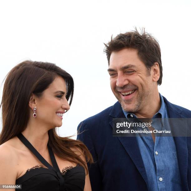 Actress Penelope Cruz, wearing jewels by Atelier Swarovski Fine Jewelry, smiles with actor Javier Bardem at the photocall for "Everybody Knows "...