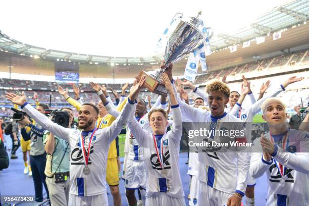 Bryan Mbeumo, Julien Masson and Calvin Bombo of Troyes celebrate winning the U19 National Cup Final match between Tours and Troyes at Stade de France...