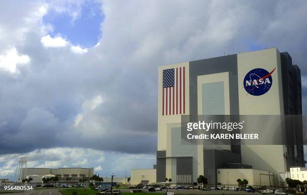 Heavy clouds begin to move over the Vehicle Assembly Building on September 11, 2009 at the Kennedy Space Center in Florida. NASA waved off two...