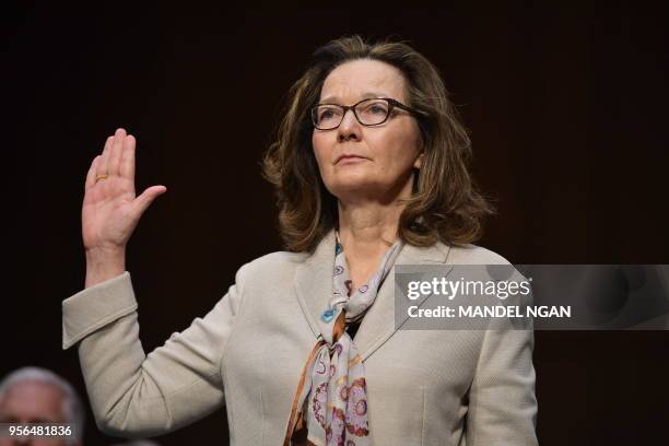 Nominee Gina Haspel takes the oath during her confirmation hearing before the Senate Select Intelligence Committee on Capitol Hill May 9, 2018 in...