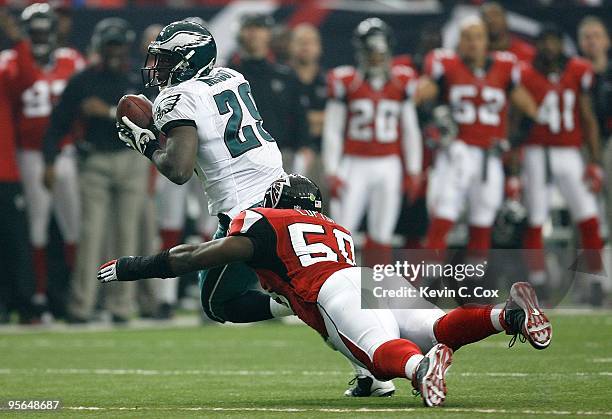 LeSean McCoy of the Philadelphia Eagles against Curtis Lofton of the Atlanta Falcons at Georgia Dome on December 6, 2009 in Atlanta, Georgia.