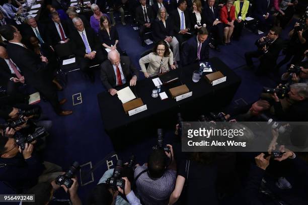 Director nominee Gina Haspel , former Sen. Saxby Chambliss and former Sen. Evan Bayh wait for the beginning of her confirmation hearing before the...