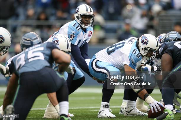 Vince Young of the Tennessee Titans stands under center Kevin Mawae during the game against the Seattle Seahawks on January 3, 2010 at Qwest Field in...