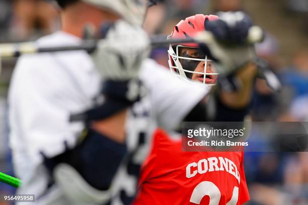 Jake Pulver of the Cornell Big Red defends Jackson Morrill of the Yale Bulldogs during the 2018 Ivy League Men's Lacrosse Championship at Lawrence A....