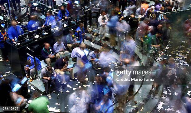 Traders work in the crude oil options pit moments before the closing bell at the New York Mercantile Exchange January 8, 2010 in New York City. Crude...