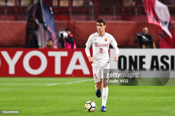 Oscar of Shanghai SIPG drives the ball during the AFC Champions League Round of 16 first leg match between Kashima Antlers and Shanghai SIPG at...