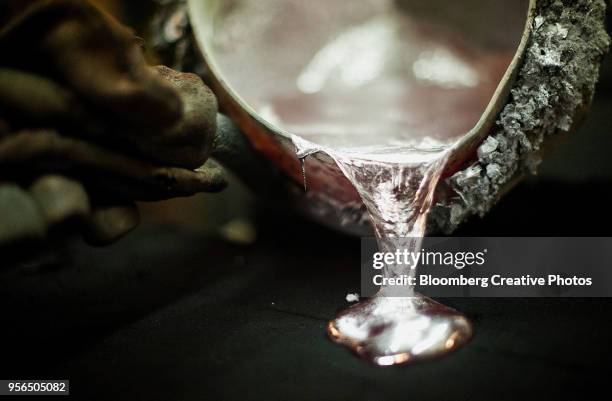 molten aluminum is poured into a mold - molten stock pictures, royalty-free photos & images