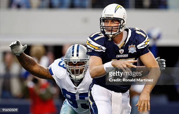 Quarterback Philip Rivers of the San Diego Chargers throws the ball in front of Anthony Spencer of the Dallas Cowboys at Cowboys Stadium on December...