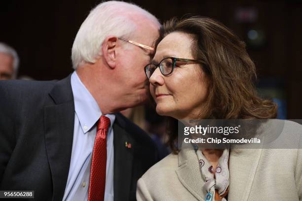 Central Intelligence Agency acting Director Gina Haspel talks with former Sen. Saxby Chambliss during her confirmation hearing to become the next CIA...