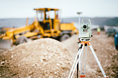 Surveyor equipment GPS system or theodolite outdoors at highway construction site. Surveyor engineering with total station