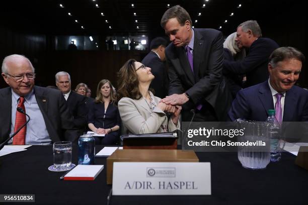 Central Intelligence Agency acting Director Gina Haspel shakes hands with Senate Intelligence Committee ranking member Sen. Mark Warner before her...