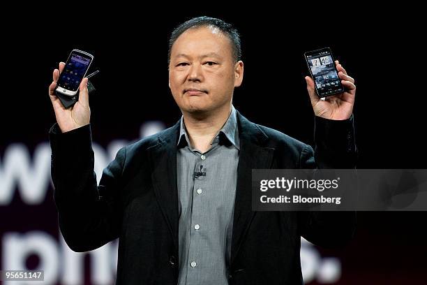 Peter Chou, chairman of HTC Corp., holds up HTC smartphones, including the Google Nexus One, left, during the 2010 International Consumer Electronics...