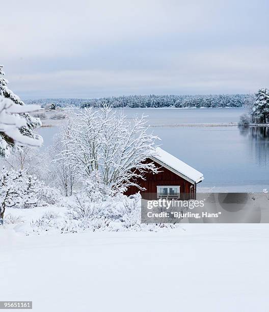 cottage by a river in the winter, sweden. - gastrikland stock pictures, royalty-free photos & images