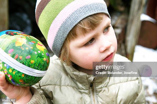 a little girl with an easter egg, sweden. - påskägg bildbanksfoton och bilder