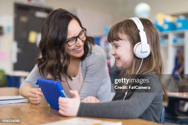 first graders in the classroom - inclusive classroom stock pictures, royalty-free photos & images