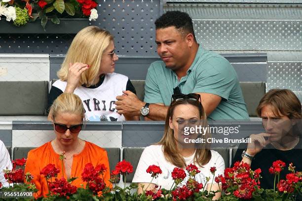 Former professional footballer Ronaldo watches the Rafael Nadal v Gael Monfils second round match on day five of the Mutua Madrid Open at La Caja...