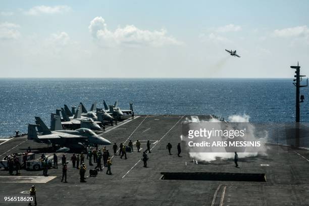 An F18 Hornet fighter jet takes off from the 330 meters navy aircraft carrier USS Harry S. Truman in the eastern Mediterranean Sea on May 8, 2018. -...