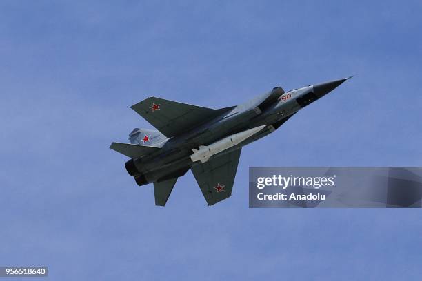 Mikoyan MiG-31K fighter jets with Kinzhal hypersonic missiles fly over Moscow's Red Square during the Victory Day military parade marking the 73rd...