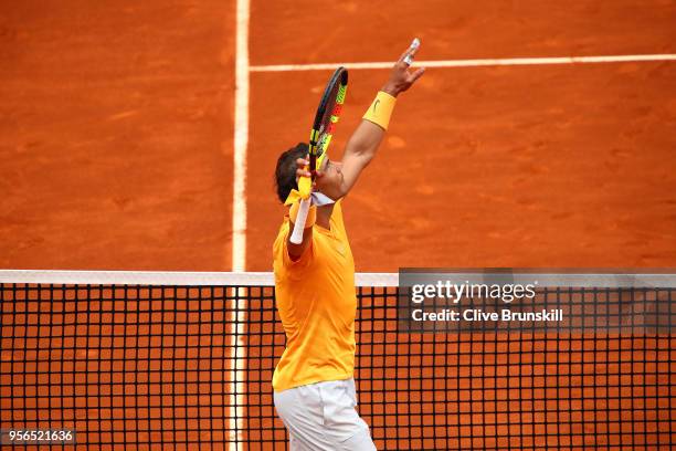 Rafael Nadal of Spain celebrates beating Gael Monfils of France during their second round match on day five of the Mutua Madrid Open at La Caja...