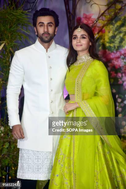 Indian film actor Ranbir Kapoor with actress Alia Bhatt attend the wedding reception of actress Sonam Kapoor and Anand Ahuja at hotel Leela in Mumbai.