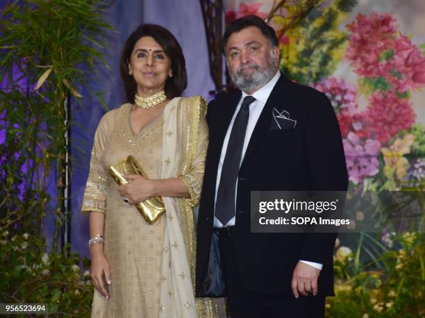Indian film actor Rishi Kapoor with wife Neetu Kapoor attend the wedding reception of actress Sonam Kapoor and Anand Ahuja at hotel Leela in Mumbai.