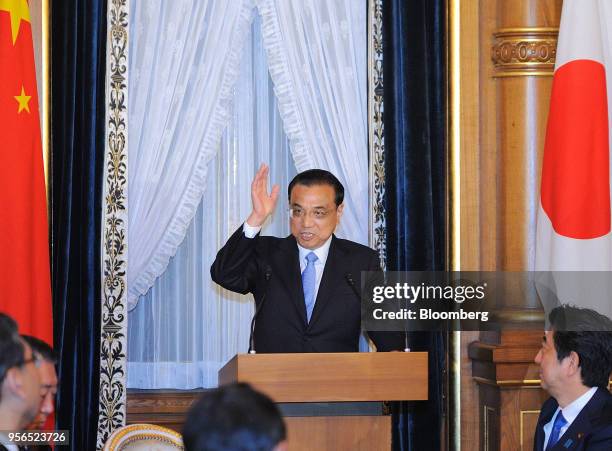Li Keqiang, China's premier, gestures while speaking during a joint news conference following a bilateral summit with Shinzo Abe, Japan's prime...