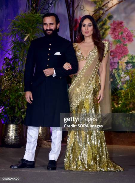 Indian film actress Kareena Kapoor Khan with husband Saif Ali Khan attend the wedding reception of actress Sonam Kapoor and Anand Ahuja at hotel...