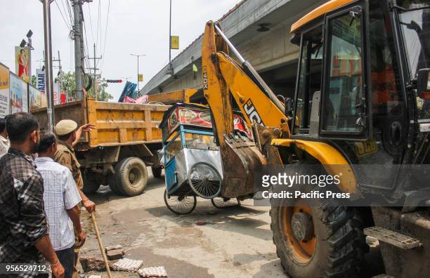 An eviction drive being carried out on footpath vendors by Guwahati Municipal Corporation in G.S Road, Guwahati.