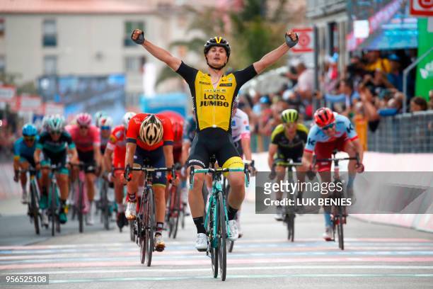 Italy's rider of team Lotto-Jumbo Enrico Battaglin celebrates as he crosses the finish line to win the 5th stage between Agrigento and Santa Ninfa...
