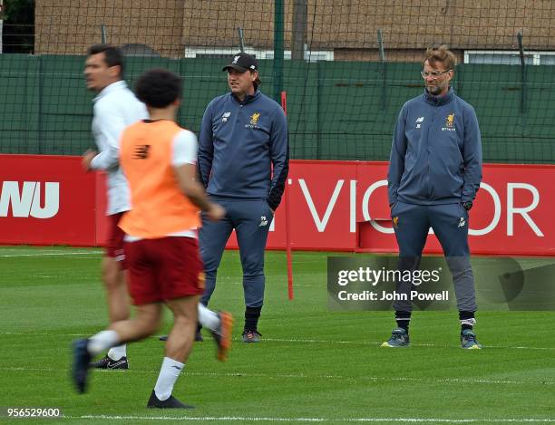 Jurgen Klopp manager of Liverpool with Peter Krawietz during a training session at Melwood on May 9, 2018 in Liverpool, England.