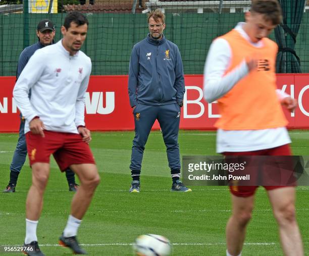 Jurgen Klopp manager of Liverpool with Peter Krawietz during a training session at Melwood on May 9, 2018 in Liverpool, England.