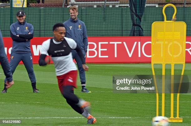 Jurgen Klopp manager of Liverpool with Peter Krawietz during a training session at Melwood on May 9, 2018 in Liverpool, England.